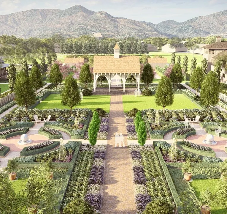 A formal garden with geometric flower beds, fountains, benches, and a gazebo, surrounded by greenery with mountains in the background.