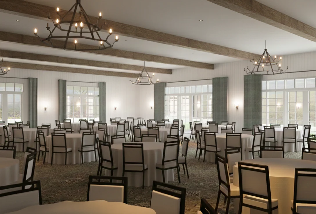 Spacious banquet hall with round tables and chairs, large windows, chandeliers, and exposed wooden ceiling beams, set for an event.