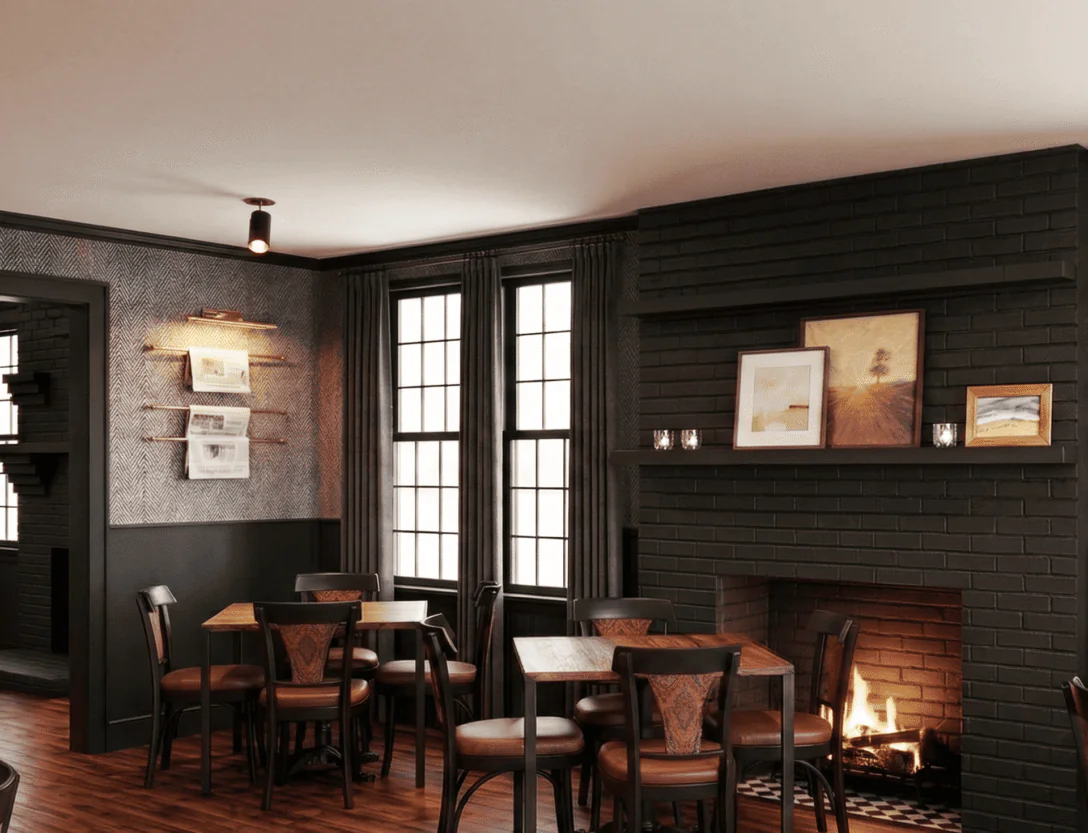 Cozy restaurant with dark walls, wooden tables and chairs, a lit fireplace, framed art, and large windows letting in natural light.