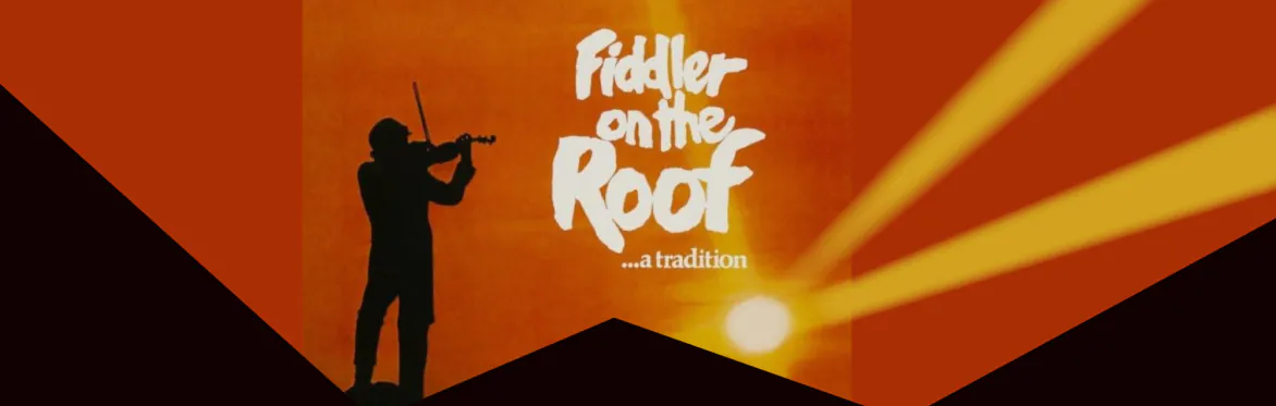 Silhouette of a fiddler playing violin on a roof at sunset, with the text Fiddler on the Roof ...a tradition.